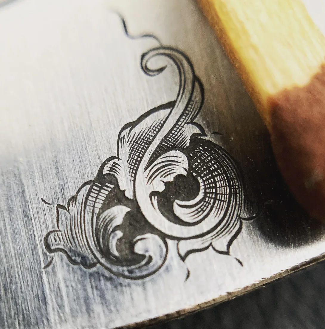 Hand engraving of an ornament on steel