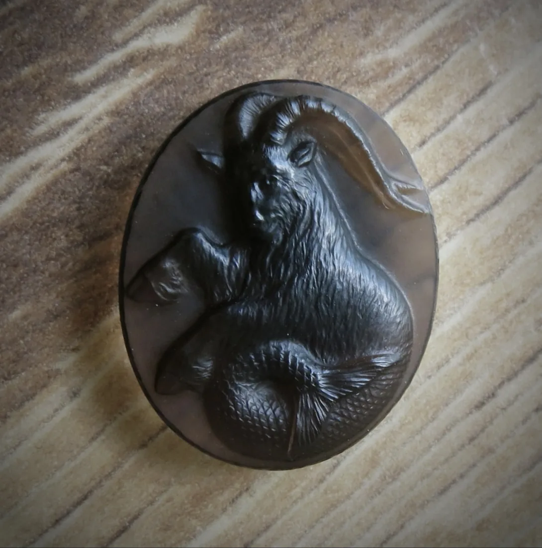 Hand-carved stone cameo of a ram